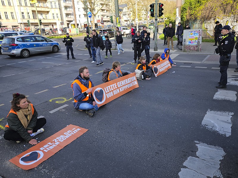Climate activists block a road during a climate protest Friday in Berlin.
(AP/Frank Jordans)