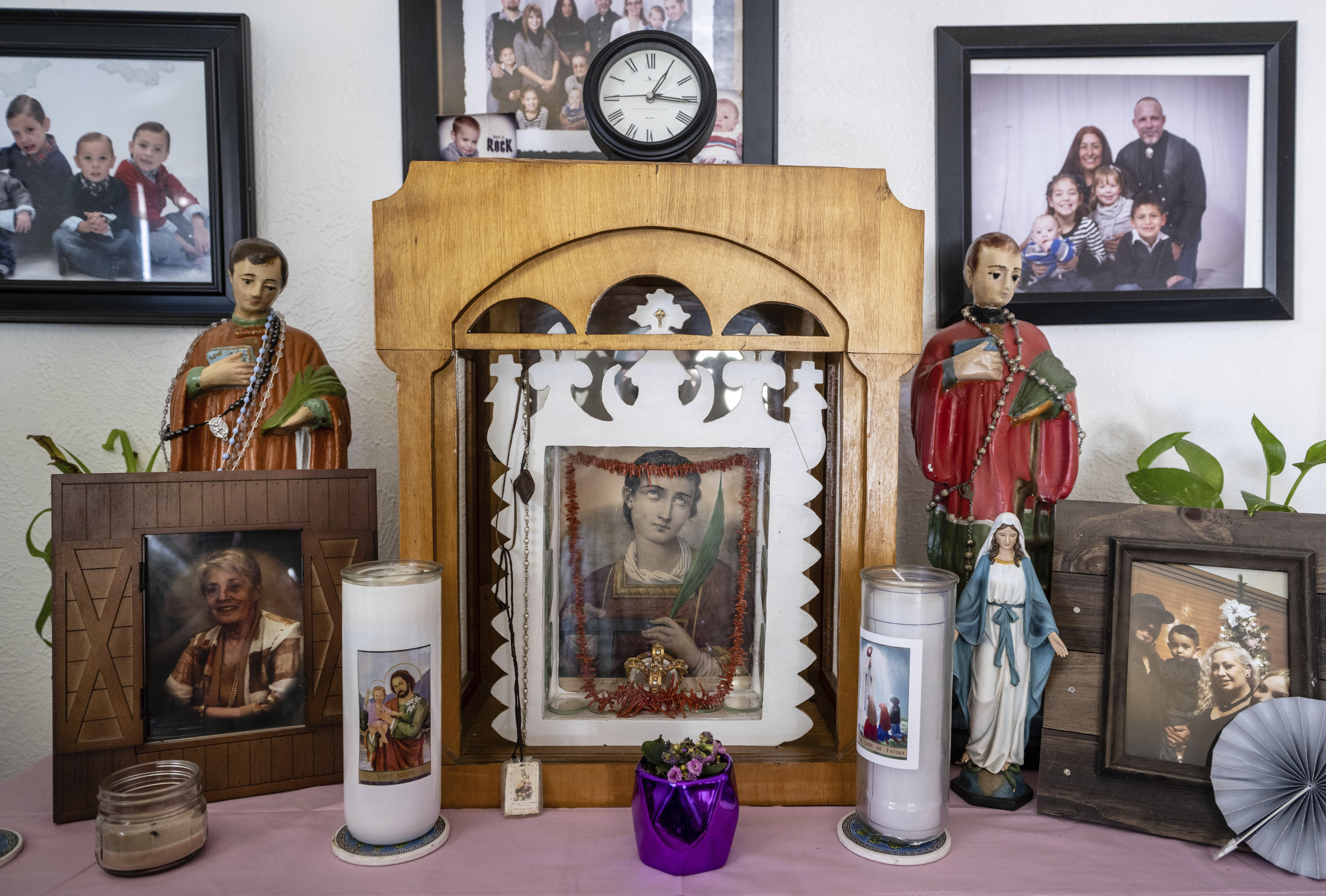 An altar dedicated to San Lorenzo, or Saint Lawrence, is displayed in the home of Barbara Finley, in Bernalillo, New Mexico, Monday, April 17, 2023.