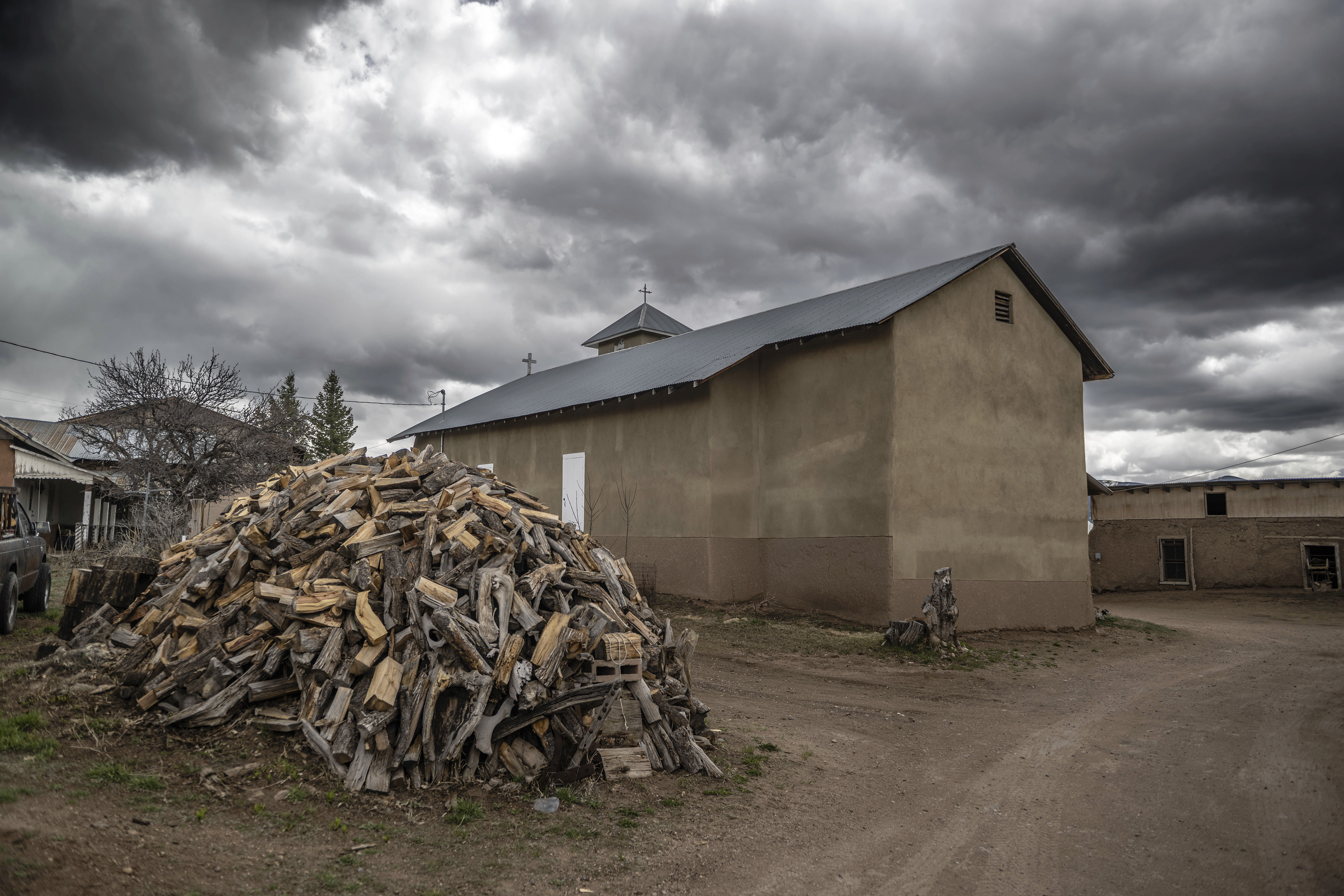 An exterior view of the 1760's Holy Rosary Mission church in Truchas, New Mexico, Friday, April 14, 2023. Hundreds of historic adobe churches like this survive in northern New Mexico, cared for by