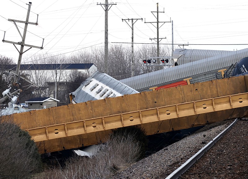 FILE - Multiple cars of a Norfolk Southern train lie toppled on one another after derailing at a train crossing near Springfield, Ohio, on March 4, 2023. (Bill Lackey/Springfield-News Sun via AP, File)