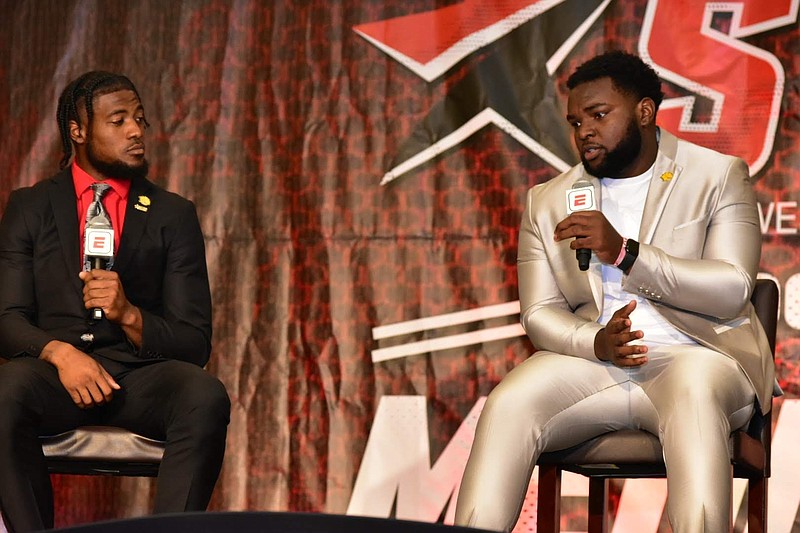 Mark Evans II (right), a left tackle at the University of Arkansas at Pine Bluff, speaks to ESPN reporters as quarterback Skyler Perry listens during SWAC Media Day in Birmingham, Ala., in this July 21, 2022 file photo. (Pine Bluff Commercial/I.C. Murrell)