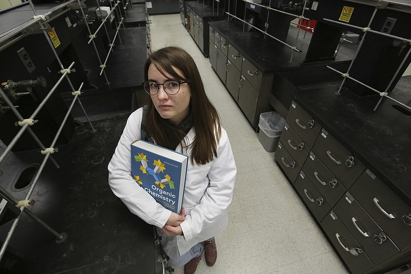 Ricki Korba, 23, stands for a portrait in her lab at California State University, Bakersfield in Bakersfield, Calif., on Friday, April 14, 2023. After taking classes at a community college, Korba was admitted to CSU, Bakersfield, as a transfer student. But when she logged on to her student account, she got a gut punch: Most of her previous classes wouldn’t count. (AP Photo/Gary Kazanjian)