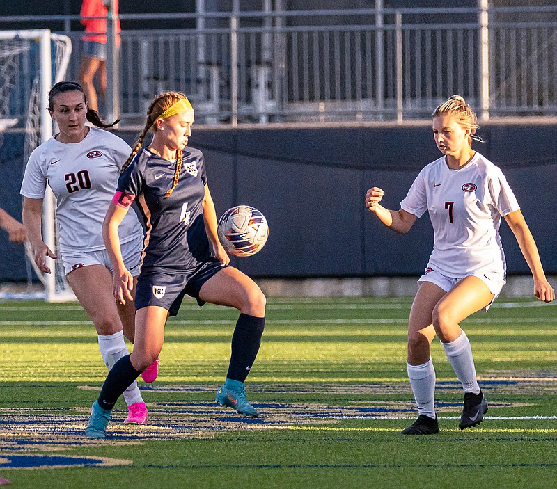 Dani Buker of Helias attempts to control the ball between Jefferson City teammates Jaden Peters (20) and Mia Allen during Wednesday night’s Central Missouri Activities Conference match at the Crusader Athletic Complex. (Josh Cobb/News Tribune)