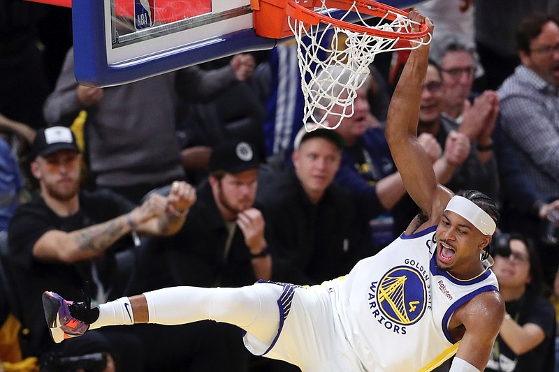 Golden State Warriors' Moses Moody celebrates after his dunk against the Los Angeles Lakers at the end of the third quarter of Game 2 of an NBA basketball Western Conference semifinal game in San Francisco, Thursday, May 4, 2023. (Scott Strazzante/San Francisco Chronicle via AP)