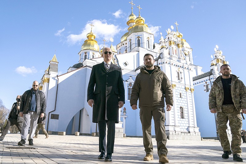 President Joe Biden walks with Ukrainian President Volodymyr Zelenskyy at St. Michael's Golden-Domed Cathedral on a surprise visit, in in Kyiv, Monday, Feb. 20, 2023. (AP Photo/ Evan Vucci)