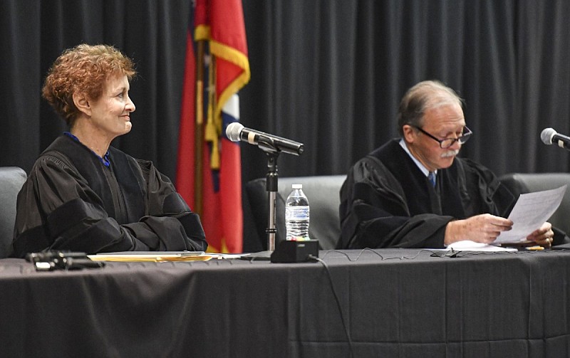Arkansas Supreme Court Justice Karen Baker (left) looks on as Chief Justice John Dan Kemp delivers opening remarks at an Appeals on Wheels event inside the Reynolds Room of the Smith-Pendergraft Campus Center at the University of Arkansas at Fort Smith in this Oct. 20, 2022 file photo. (NWA Democrat-Gazette/Hank Layton)