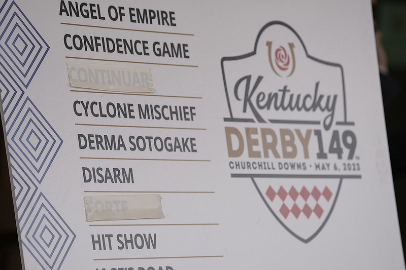 AP photo by Charlie Riedel / A poster shows Continuar, third from the top, and early favorite Forte, second from the bottom, were scratched from the lineup for the 149th running of the Kentucky Derby on Saturday at Churchill Downs in Louisville, Ky.