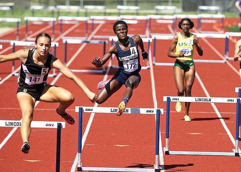 Lincoln’s Maria Diamond clears a hurdle near the halfway point of the women’s 400-meter hurdles final during the MIAA outdoor track and field championships Sunday at Dwight T. Reed Stadium. (Greg Jackson/News Tribune)