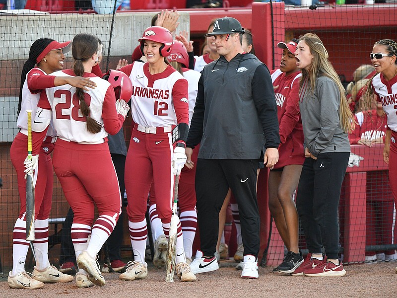 Arkansas designated player Rylin Hedgecock (28) is congratulated Monday, May 1, 2023, by teammates after hitting a 2-run home run during the fourth inning of the Razorbacks’ 2-0 win over Tennessee at Bogle Park in Fayetteville. Visit nwaonline.com/photo for today's photo gallery. .(NWA Democrat-Gazette/Andy Shupe)