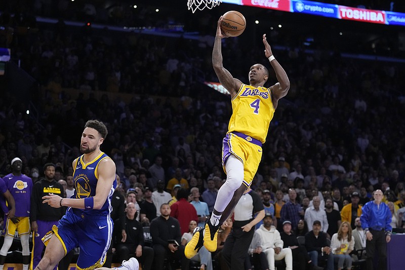 Los Angeles Lakers guard Lonnie Walker IV, right, shoots as Golden State Warriors guard Klay Thompson defends during the second half in Game 4 of an NBA basketball Western Conference semifinal Monday, May 8, 2023, in Los Angeles. (AP Photo/Marcio Jose Sanchez)