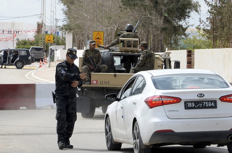 A policeman checks a car on Wednesday near Ghriba synagogue in Djerba, Tunisia.
(AP/Moncef Abidi)