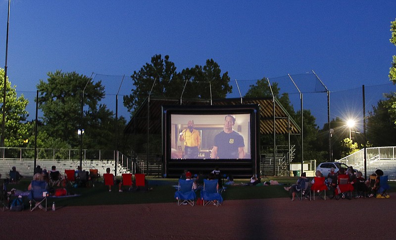 News Tribune file photo: Small groups gather May 21, 2021, at Vivion Field in Jefferson City, where Stars Under the Stars presented a movie outdoors. The program's movies during the 2023 season are being shown on the south lawn of the Missouri Capitol.