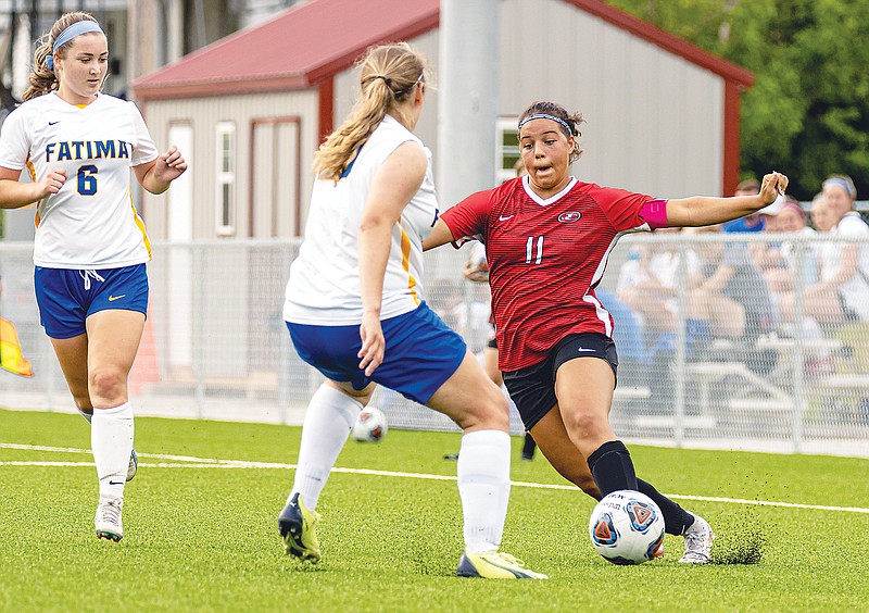 Jefferson City's Jada Barlow looks for a way around the Fatima defense during Wednesday night’s match at Jefferson City High School. (Josh Cobb/News Tribune)