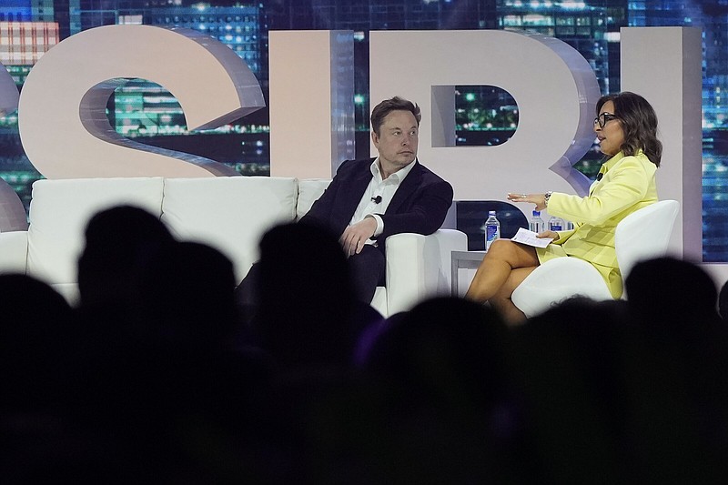 Elon Musk speaks with Linda Yaccarino, chairman of global advertising and partnerships for NBC, at the POSSIBLE marketing conference on April 18 in Miami Beach, Fla. Musk said Friday that Yaccarino will be the new CEO of Twitter Corp., or X Corp. as it’s now called.
(AP)