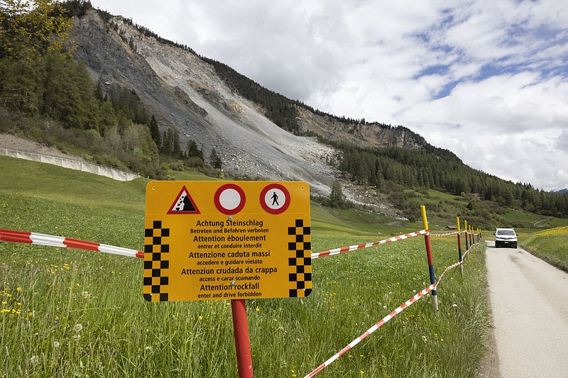 A warning sign is seen Friday in front of the “Brienzer Rutsch,” the rockfall danger zone in Brienz-Brinzauls, Switzerland.
(AP/Arnd Wiegmann)