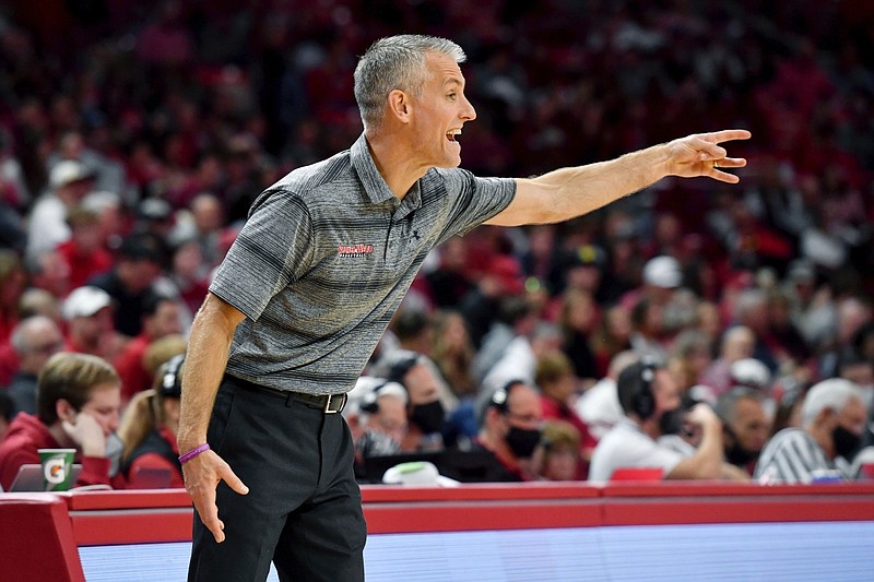 Gardner-Webb coach Tim Craft reacts to a call against Arkansas during the first half of an NCAA college basketball game, Saturday, Nov. 13, 2021, in Fayetteville, Ark. (AP Photo/Michael Woods)