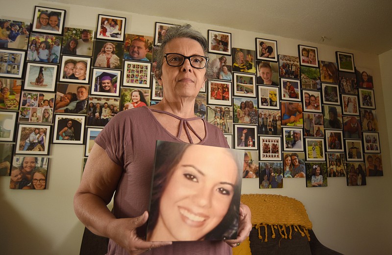 Staff photo by Matt Hamilton /  Wendy Eyrich holds a photo of her daughter, Stephanie Jackson, who died last year of a drug overdose, after an interview at her Hixson home on Tuesday, April 25, 2023.