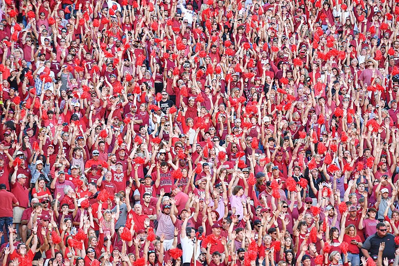 Arkansas fans call the hogs, Saturday, Oct. 1, 2022, during the third quarter of the Razorbacks’ 49-26 loss to Alabama at Donald W. Reynolds Razorback Stadium in Fayetteville.