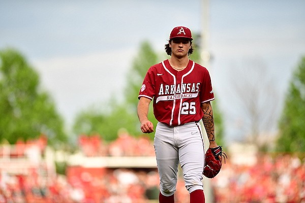 Arkansas pitcher Brady Tygart walks toward the dugout during a game against South Carolina on Saturday, May 13, 2023, in Fayetteville.