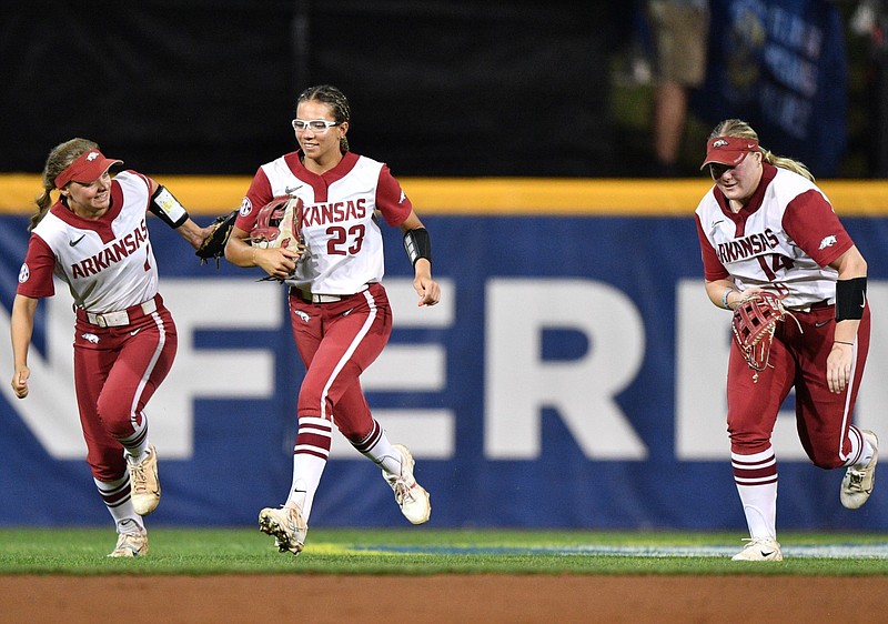 Arkansas Razorback outfielders are shown during the SEC Softball Tournament at Bogle Park in Fayetteville in this May 11, 2023 file photo. From left are Raigan Kramer, Reagan Johnson and Kacie Hoffmann. (NWA Democrat-Gazette/Andy Shupe)