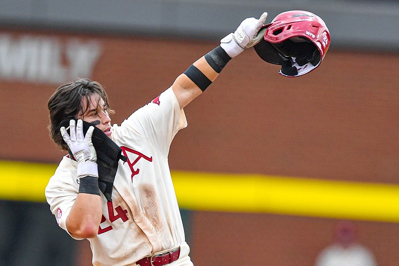 Arkansas second baseman Peyton Holt celebrates after hitting a double, Sunday, May 14, 2023, during the fifth inning of the Razorbacks’ 5-1 win over the South Carolina Gamecocks at Baum-Walker Stadium in Fayetteville.