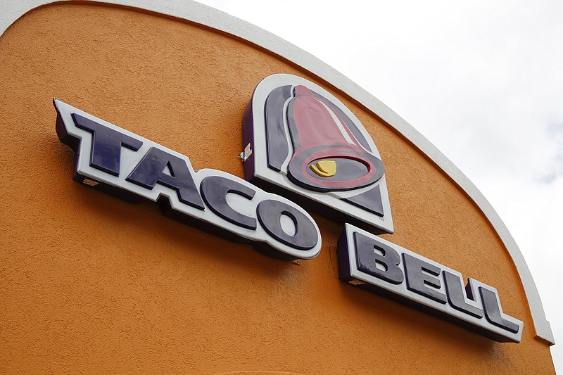 FILE - A sign hangs at a Taco Bell on May 23, 2014, in Mount Lebanon, Pa. Declaring a mission to liberate "Taco Tuesday" for all, Taco Bell asked U.S. regulators Tuesday, May 16, 2023, to force Wyoming-based Taco John's to abandon its longstanding claim to the trademark. (AP Photo/Gene J. Puskar, File)