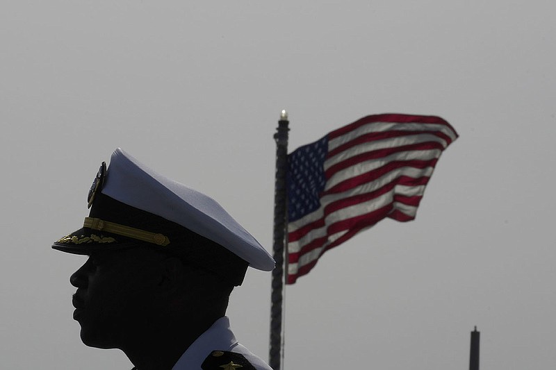 Cmdr. Executive Officer Tyrchra Bowman stands on the deck of the guided-missile destroyer USS Arleigh Burke on Wednesday at its docking in the port in southern city of Limassol, Cyprus.
(AP/Petros Karadjias)