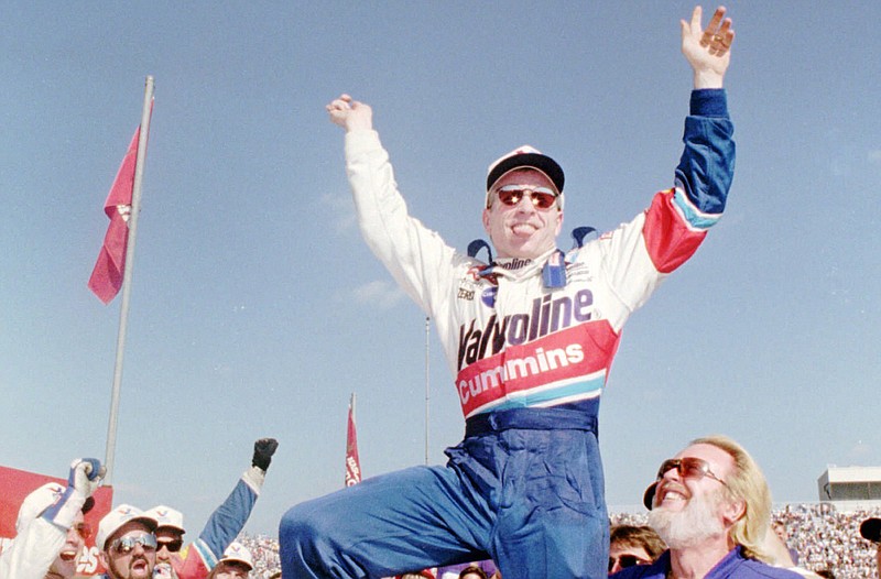Driver Mark Martin, from Batesville, celebrates in victory lane at the North Wilkesboro Speedway, near North Wilkesboro, N.C., in this Oct. 1, 1995 file photo, after winning the Tyson Holly Farms 400.(AP Photo/Alan Marler)
