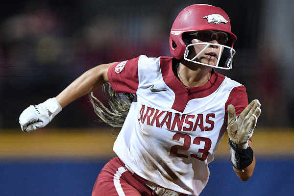 Arkansas center fielder Reagan Johnson rounds third and heads for the plate Thursday, May 11, 2023, on a single by first baseman Cylie Halvorson during the sixth inning of the Razorbacks’ 3-2, 9-inning loss to Alabama in the SEC Softball Tournament in Fayetteville.