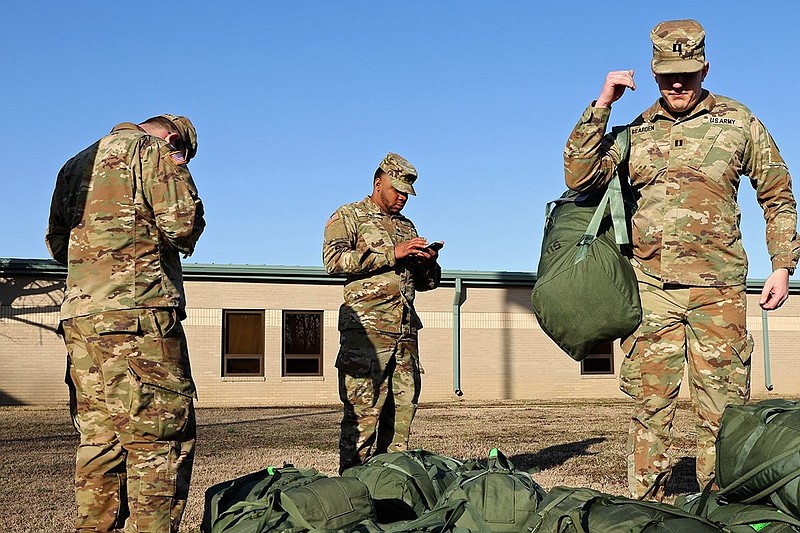 Arkansas National Guard members at the Searcy Armory prepare to depart for Fort Bliss, Texas, in this Feb. 5, 2023 file photo. (Arkansas Democrat-Gazette/Colin Murphey)