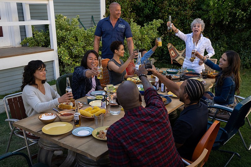 We are family: Hot rod enthusiasts (clockwise, from left) Letty (Michelle Rodriguez), Han (Sung Kang), Ramsey (Nathalie Emmanuel), Dom (Vin Diesel), Little Brian (Leo Abelo Perry), Abuelita (Rita Moreno), Mia (Jordana Brewster), Tej (Chris ‘Ludacris’ Bridges, back to camera) and Roman (Tyrese Gibson, back to camera) get together one more time in “Fast X.”