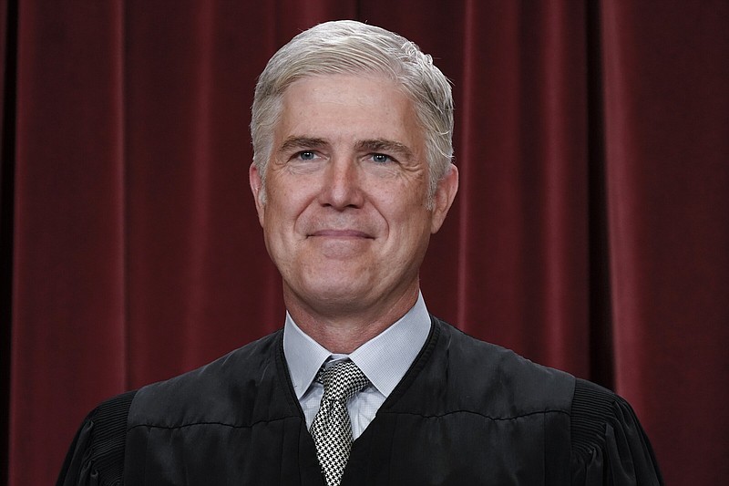 Associate Justice Neil Gorsuch joins other members of the Supreme Court as they pose for a new group portrait, at the Supreme Court building in Washington in October 2022.
(AP/J. Scott Applewhite)