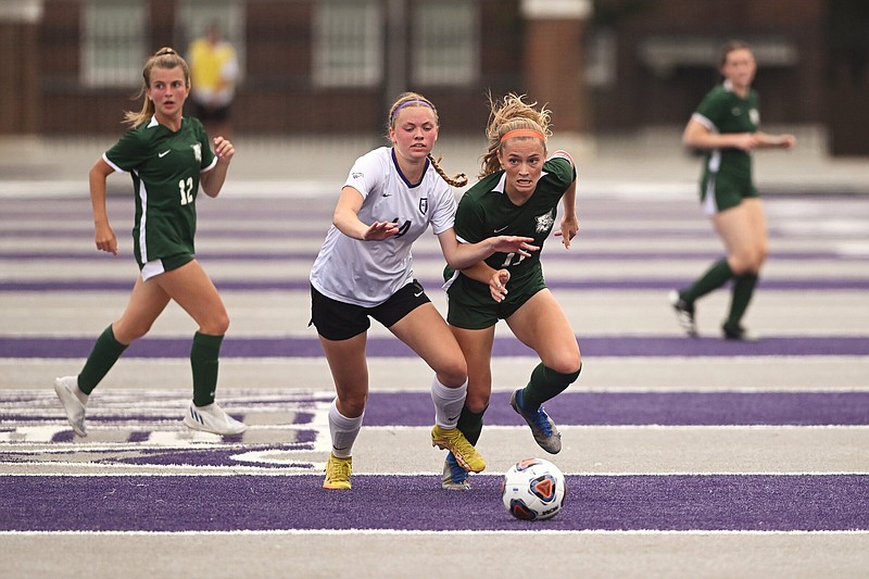 Central Arkansas Christian’s Ally Koone (left) and Episcopal Collegiate’s Samantha De Luca battle for the ball during the Class 3A girls soccer state championship Friday at Estes Stadium in Conway. More photos at arkansasonline.com/520soccer3a/
(Arkansas Democrat-Gazette/Staci Vandagriff)