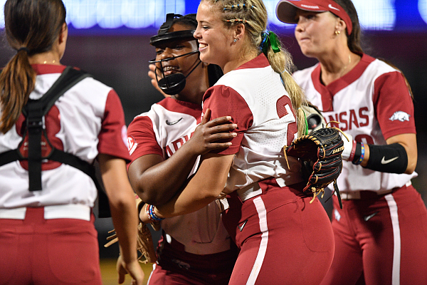 Arkansas starting pitcher Chenise Delce celebrates Thursday, May 11, 2023, with third baseman Hannah Gammill during the seventh inning of the Razorbacks’ 3-2, 9-inning loss to Alabama in Fayetteville.