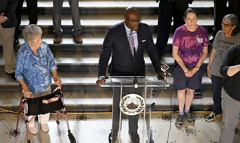 City Directors (from left) Joan Adcock, Capi Peck and Kathy Webb join Mayor Frank Scott Jr. as he gives an update on tornado recovery funds on May 19, 2023, at a news conference in the City Hall rotunda. (Arkansas Democrat-Gazette/Stephen Swofford)