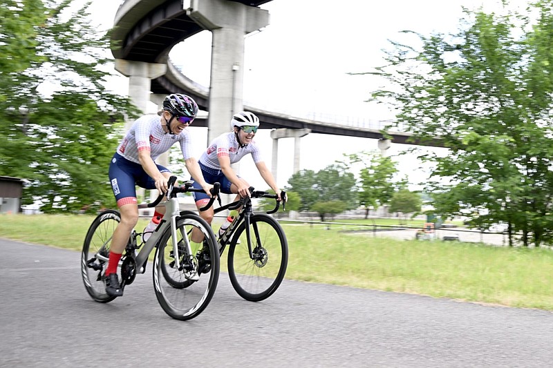 Cyclists ride along the Arkansas River Trail beneath the Big Dam Bridge in Little Rock on Tuesday, May 16, 2023. (Arkansas Democrat-Gazette/Stephen Swofford)