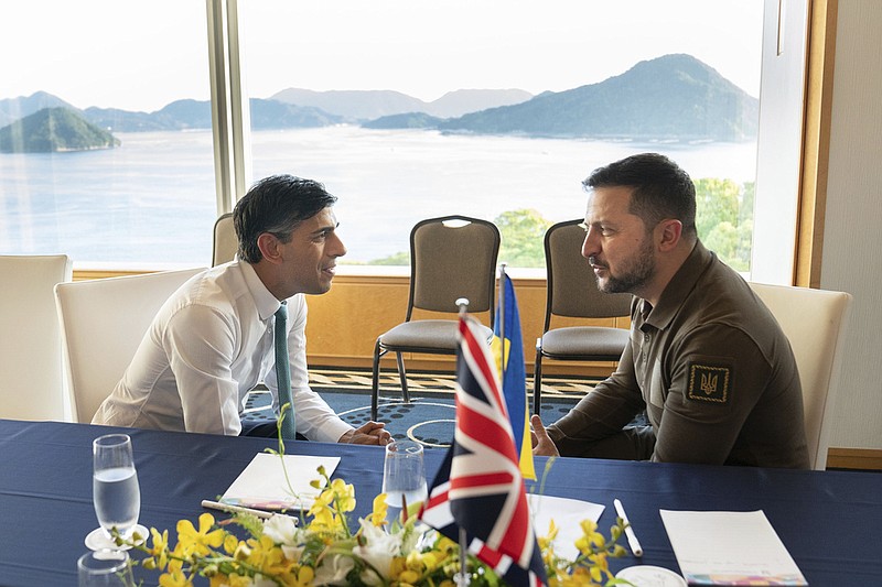 Britain's Prime Minister Rishi Sunak, left, and Ukraine President Volodymyr Zelenskyy meet at the Grand Prince Hotel, during the G7 Summit in Hiroshima, Japan, Saturday, May 20, 2023. (Stefan Rousseau/Pool via AP)