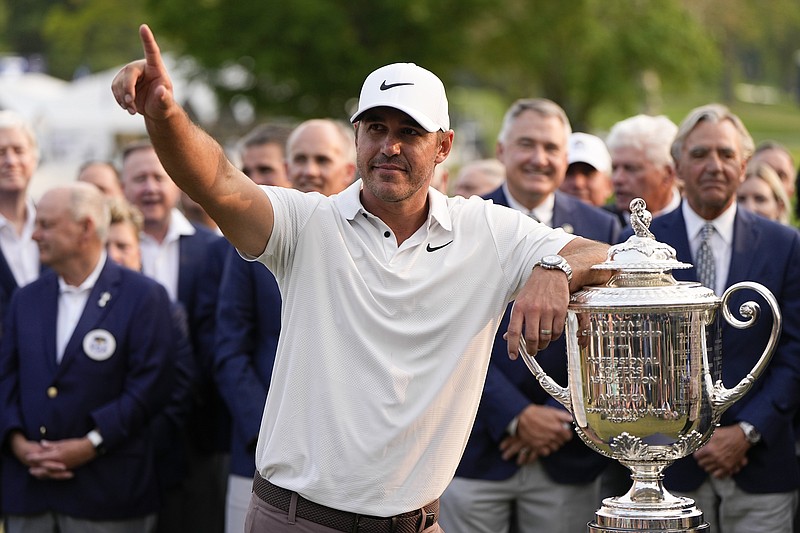 Brooks Koepka celebrates with the Wanamaker trophy after winning the PGA Championship golf tournament at Oak Hill Country Club on Sunday, May 21, 2023, in Pittsford, N.Y.(AP Photo/Eric Gay)