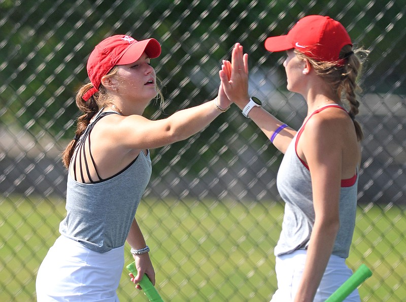 Staff Photo by Robin Rudd / Baylor's Helen Guerry, left, and Gabby Czarnecki celebrate a point against their Hutchison opponents.  TSSAA tennis was played at the Adams Tennis Center in Murfreesboro on May 23, 2023.
