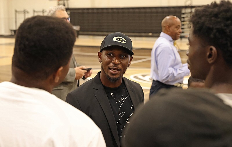 Newly hired Central High School football coach Anthony Robinson greets students at an event welcoming him to the program in the Boone-Fitzpatrick Fieldhouse on Monday, May 22, 2023. (Arkansas Democrat-Gazette/Colin Murphey)