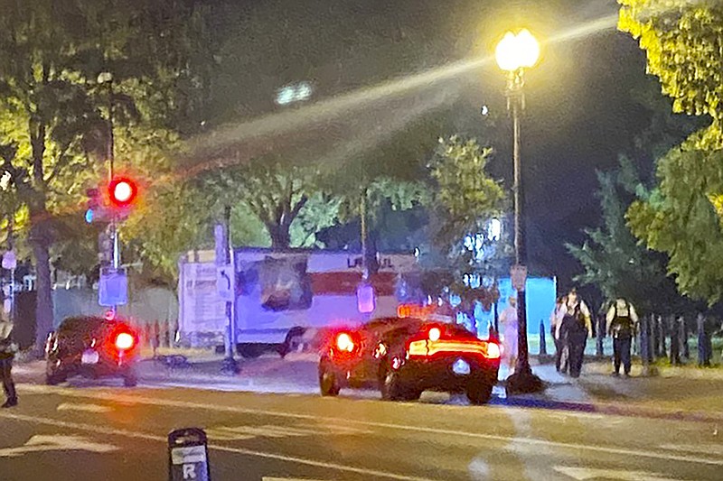 A box truck is seen crashed into a security barrier at a park across from the White House, Monday night, May 22, 2023 in Washington. Police have arrested a man they believe intentionally crashed a U-Haul truck into a security barrier near the north side of Lafayette Square late Monday night. No one was injured. (Benjamin Berger via AP)