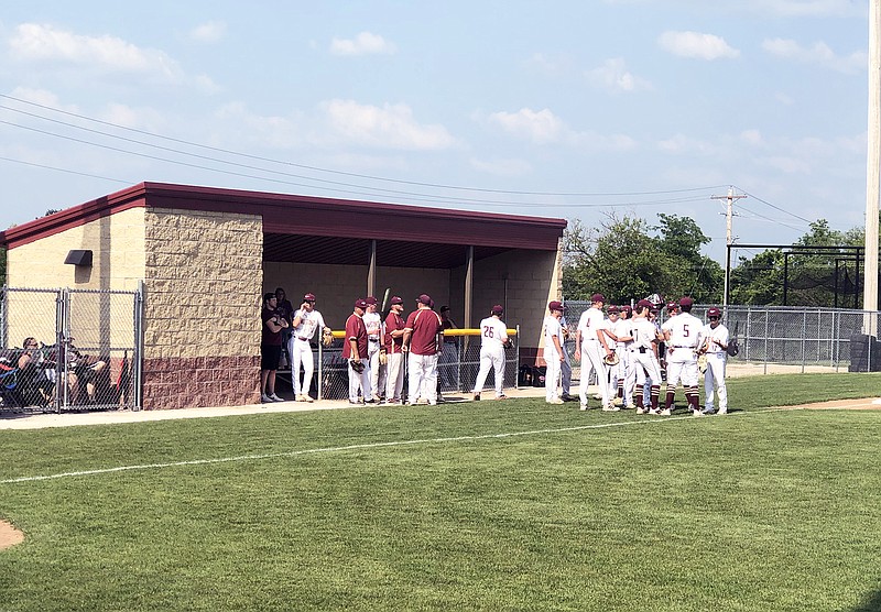 The Eldon Mustangs meet before the first pitch of Tuesday's Class 4 sectional game against the Springfield Catholic Fightin' Irish at McMillen Field in Eldon. (Tom Rackers/News Tribune)