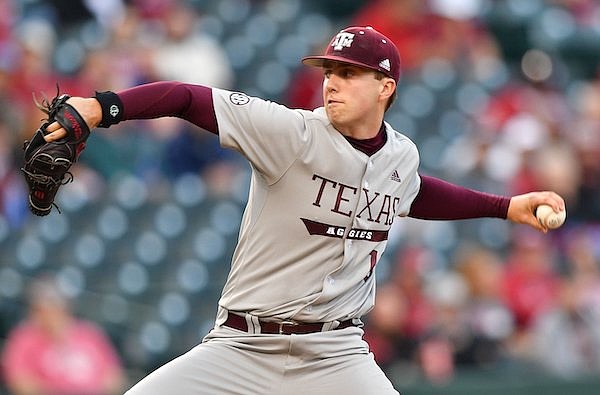 Texas A&M starter Troy Wansing delivers a pitch Thursday, April 27, 2023, during the first inning of play against Arkansas at Baum-Walker Stadium in Fayetteville.