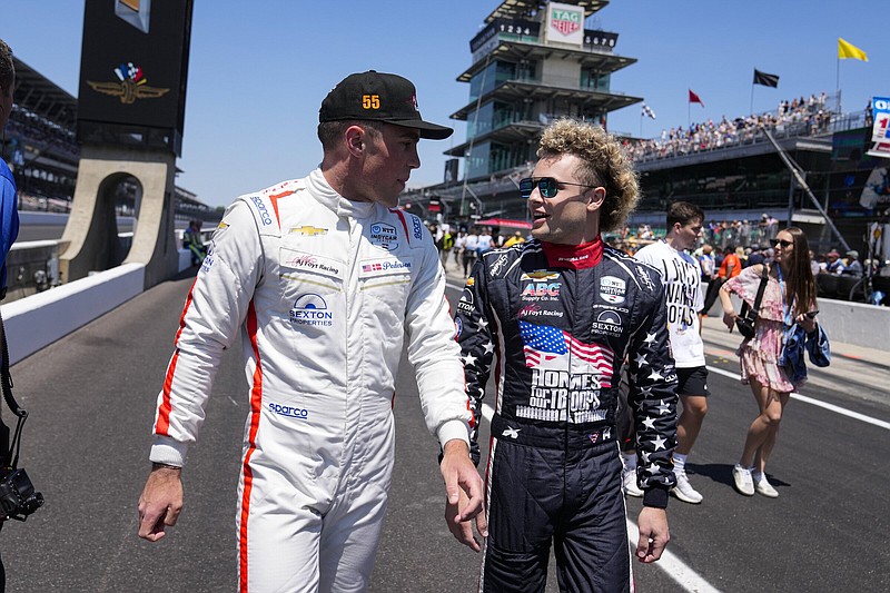 Benjamin Pedersen (left), of Denmark, walks with Santino Ferrucci on Sunday before the start of qualifications for the Indianapolis 500 auto race at Indianapolis Motor Speedway in Indianapolis.
(AP/Michael Conroy)