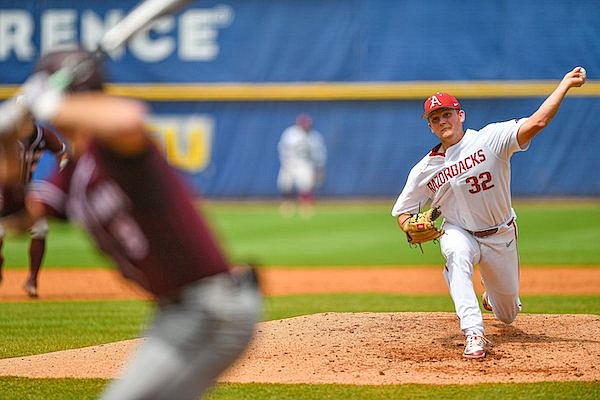 Arkansas pitcher Zack Morris (32) delivers to the plate, Wednesday, May 24, 2023, during the fourth inning of the Razorbacks’ 6-5 extra-innings win over the Texas A&M Aggies at the 2023 SEC Baseball Tournament at the Hoover Metropolitan Complex in Hoover, Ala.