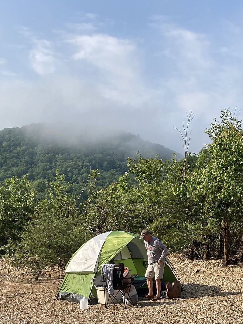 Rusty Pruitt prepares to strike camp Monday on the Buffalo National River.
(Arkansas Democrat-Gazette/Bryan Hendricks)