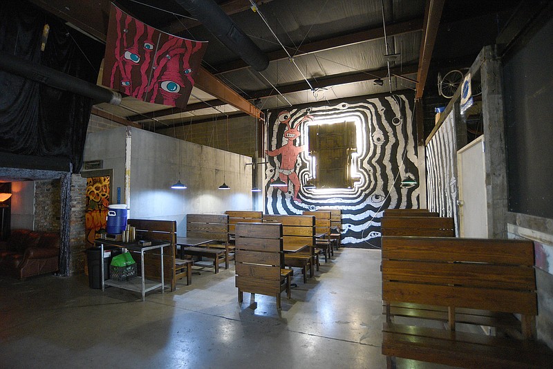 Staff Photo by Matt Hamilton / A portion of the chassis of a 1967 Ford Econoline van decorates the wall at the Boneyard Bar in 2022.