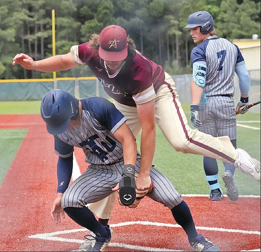 Heath Waldrop/Special to the News-Times
Making the tag: South Arkansas College pitcher Christian Clayson applies the tag to a baserunner trying to score during a game earlier this season at the El Dorado/Union County Recreation Complex. The Stars begin play in the NJCAA Division II World Series Saturday at 10 a.m. against Frederick (Md.) Community College.