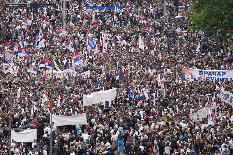 Tens of thousands of people take part in a rally in support of President Aleksandar Vucic in front of the Serbian parliament building in Belgrade, Serbia, on Friday.
(AP/Darko Vojinovic)