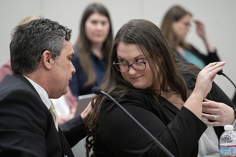 Attorneys for the state Cory Voight and Carah Rochester talk Thursday during a hearing of the state medical board at the Indiana Government South building in downtown Indianapolis.
(AP/The Indianapolis Star/Mykal McEldowney)